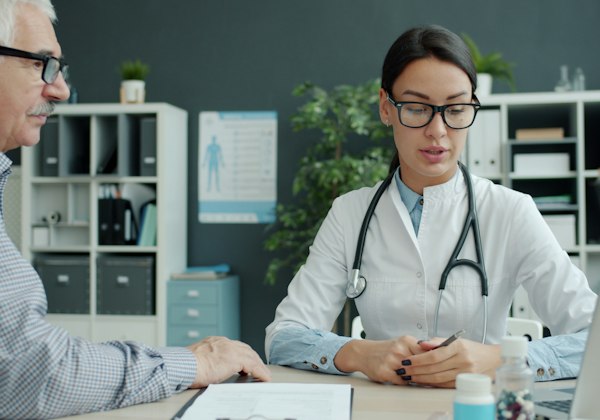 Cardiologist discussing results with a patient